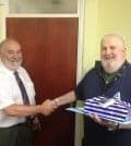 Joint Managing Director Ray Johnson presents John with gifts and best wishes.