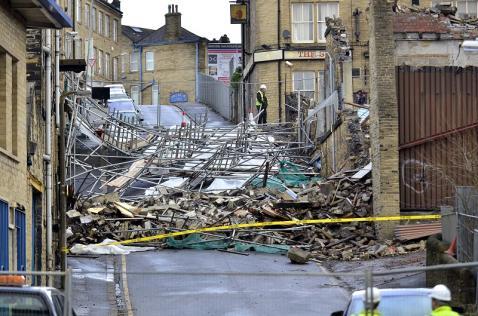 Former Mill Collapses Bringing Down Scaffolding