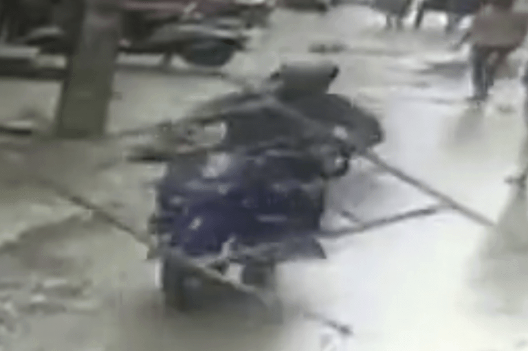 Video: Motorbike rider wiped out as scaffolding falls four storeys