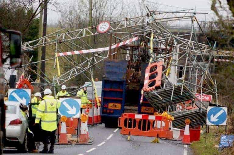 Road closed after truck smashes into scaffolding