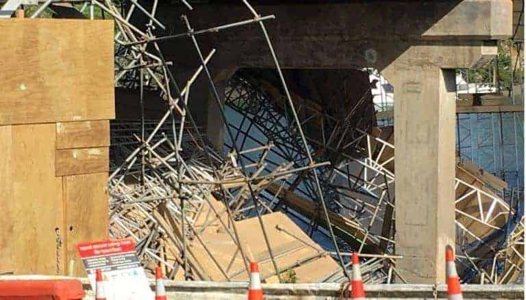 Three plunge into water after bridge scaffolding collapses