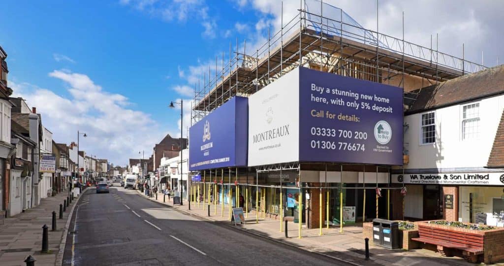 Image of building wrap showing adverts