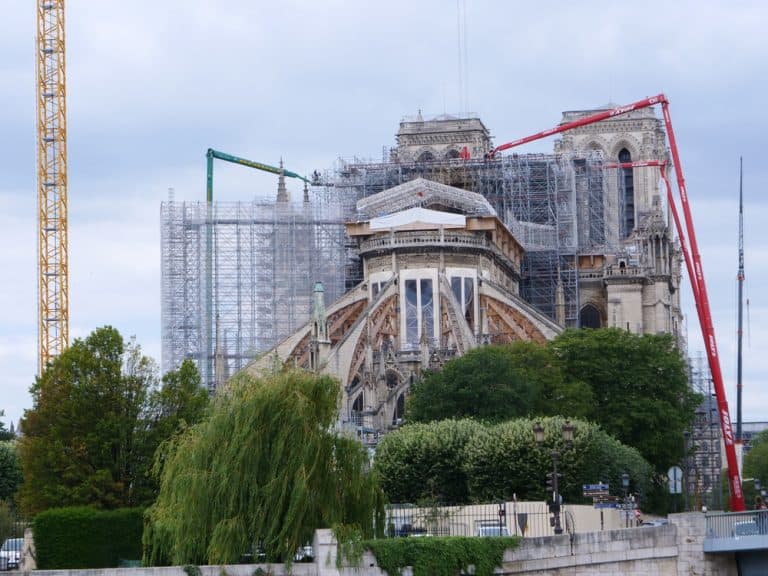 Workers start to remove melted scaffolding on Notre-Dame