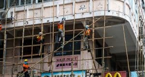 scaffolders erecting bamboo scaffolding in Hong Kong