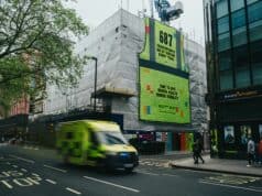 A towering 12-metre-tall mural comprising 687 high-vis vests, representing the yearly average of suicide deaths among UK tradespeople, has been unveiled in London's West End.