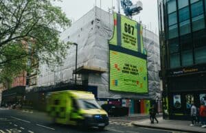 A towering 12-metre-tall mural comprising 687 high-vis vests, representing the yearly average of suicide deaths among UK tradespeople, has been unveiled in London's West End.