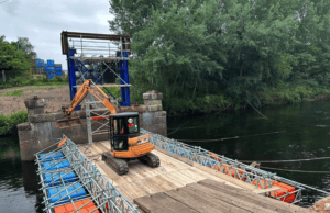 In an industry-first, specialist contractors have utilised a floating bridge crafted entirely from standard scaffolding to complete the demolition of the Hams Hall Bridge over the River Tame in Birmingham.
