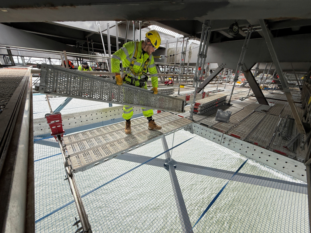 colossal scaffolding project is underway beneath the iconic Forth Road Bridge, where West Lothian-based Hardrock Scaffolding Ltd is delivering a UK-first installation using Layher’s advanced Flex Beam launching system