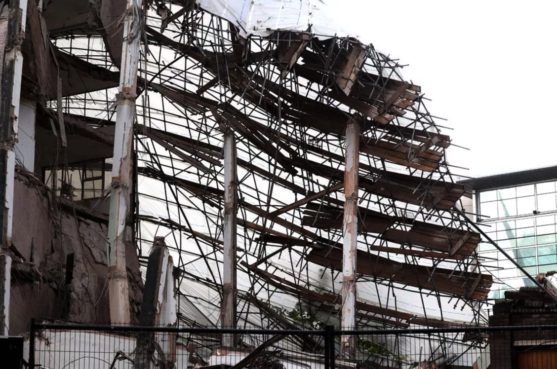 A building with scaffolding around it has partially collapsed in Manchester city centre during demolition work. NASC urges caution as investigations continue.